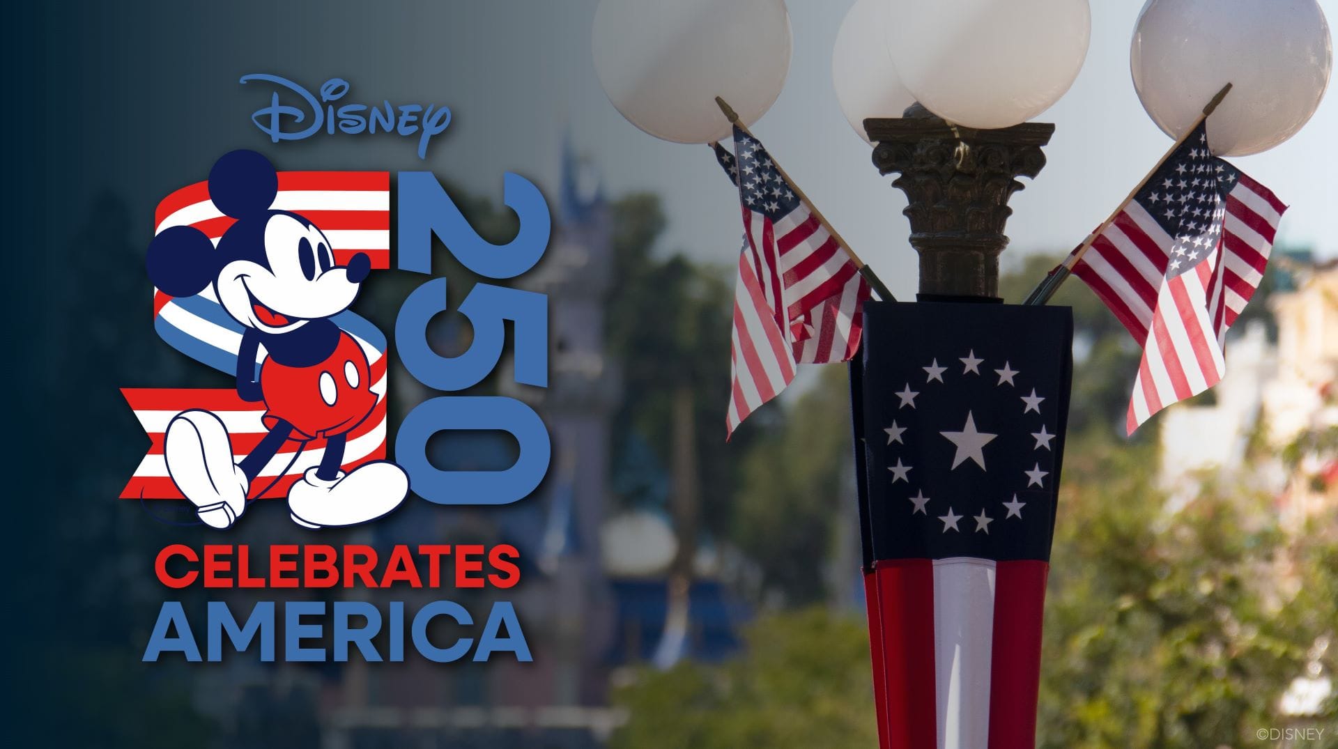Cartoon mouse character on a red, white and blue banner beside a lamp post dressed with American flags, castle blurred in the background