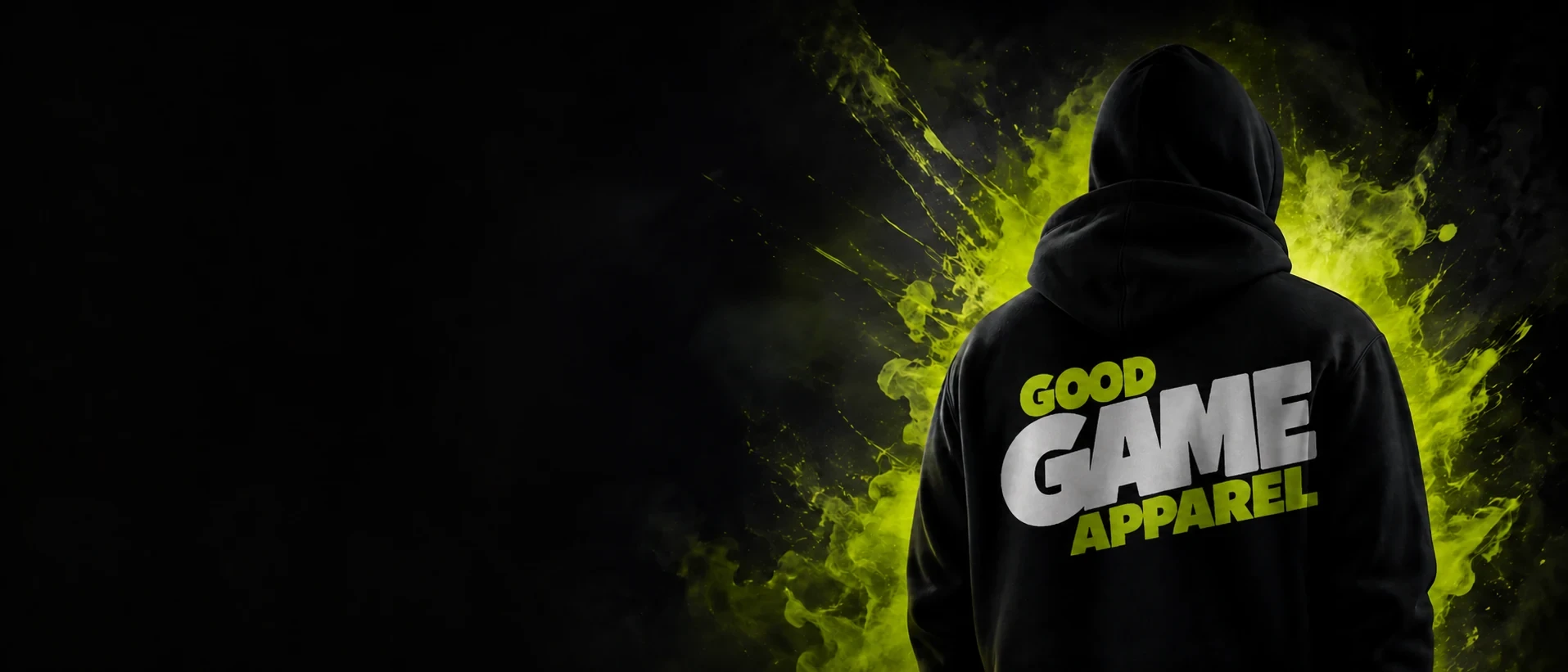 Person seen from behind in a black hoodie printed with Good Game Apparel, lit by green smoke against a black background