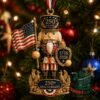 America 250th Anniversary Nutcracker Christmas Ornament - front view with flag and anniversary shield
