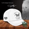 Dolly Parton Queen of Country I Will Always Love You Cap - full product view on wooden surface with Dolly