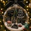 Pink Floyd 60th Anniversary Christmas Ornament 2026 - full view displayed on a decorated Christmas tree