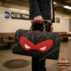 Teenage Mutant Ninja Turtles Raphael Red Mask Duffle Bag - front view with camouflage pattern